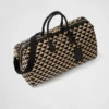 Bolso de viaje grande de tela con el símbolo de Prada bordado Bolso de viaje grande de tela con el símbolo de Prada bordado