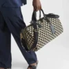 Bolso de viaje grande de tela con el símbolo de Prada bordado Bolso de viaje grande de tela con el símbolo de Prada bordado
