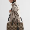 Bolso de viaje mediano de tela bordada con el símbolo de Prada Bolso de viaje mediano de tela bordada con el símbolo de Prada