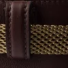 Bolso tipo cubo de cuero con hebilla de Prada y cinturón con joyas Bolso tipo cubo de cuero con hebilla de Prada y cinturón con joyas