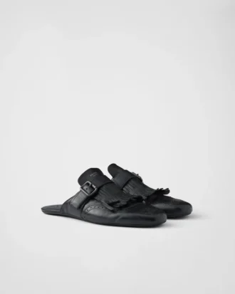 Mules de cuero con correa tipo monk y flecos