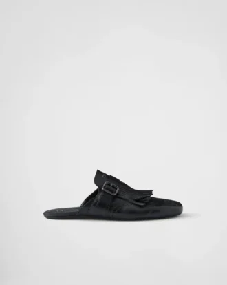 Mules de cuero con correa tipo monk y flecos