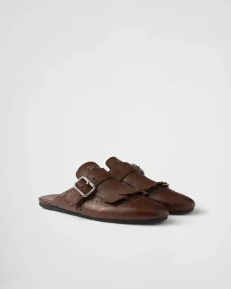 Mules de cuero con flecos Shuffle