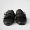 Mules de cuero con flecos Shuffle Mules de cuero con flecos Shuffle