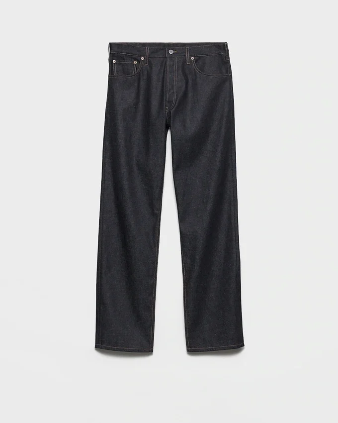 Pantalones de mezclilla sin tratar con tira de cuero Pantalones de mezclilla sin tratar con tira de cuero