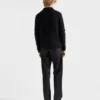 Pantalones de mezclilla sin tratar con tira de cuero Pantalones de mezclilla sin tratar con tira de cuero