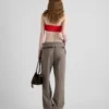 Pantalones técnicos de lana con cinturón estampado
