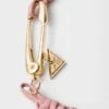 Pulsera de piel napa trenzada con adorno metálico Pulsera de piel napa trenzada con adorno metálico