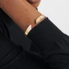 Pulsera rígida Eternal Gold en oro amarillo con diamantes Pulsera rígida Eternal Gold en oro amarillo con diamantes