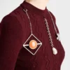 Suéter de lana de manga corta con colgantes